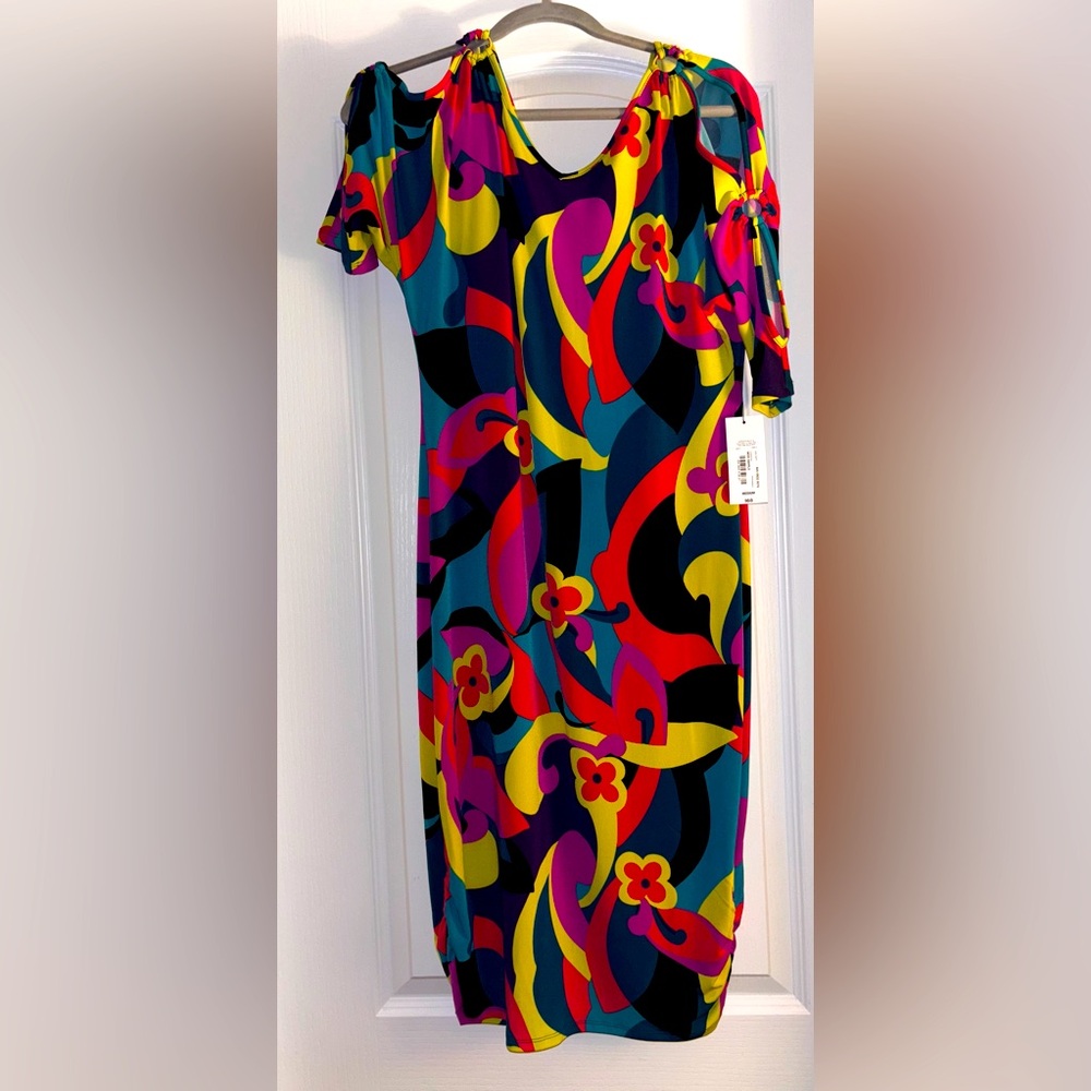 This dress is amazing! Silver ring accessories on the peekaboo sleeves sz M